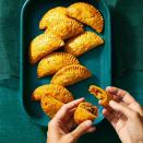 <p>Set out a plate of these savory beef empanadas with a flaky crust for guests to snack on. They make the best bite-size snacks!<br></p><p>Get the <strong><a href="https://www.goodhousekeeping.com/food-recipes/a41887042/beef-empanadas-recipe/" rel="nofollow noopener" target="_blank" data-ylk="slk:Beef Empanadas recipe;elm:context_link;itc:0;sec:content-canvas" class="link ">Beef Empanadas recipe</a></strong>.</p>