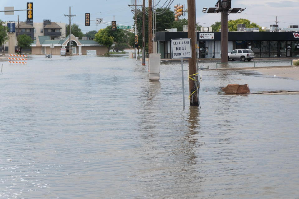 Flood waters close down Paramount Blvd. due to flooding from Lawrence Lake in Amarillo.