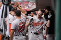 Baltimore Orioles' Jordan Westburg, right, celebrates hitting a two-run homer with Ramón Urías (29) in the dugout in the first inning of a baseball game against the Cincinnati Reds on Sunday, May 5, 2024, in Cincinnati. (AP Photo/Carolyn Kaster)