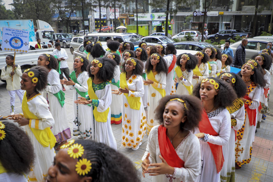 Girls from an Ethiopian Orthodox Christian religious group wear a traditional dress and sing spiritual songs, the day before the Ethiopian New Year, in Addis Ababa, Ethiopia Saturday, Sept. 10, 2022. Once home to one of Africa's fastest growing economies, Ethiopia is struggling as the war in its Tigray region has reignited and Ethiopians are experiencing the highest inflation in a decade, foreign exchange restrictions and mounting debt amid reports of massive government spending on the war effort. (AP Photo)