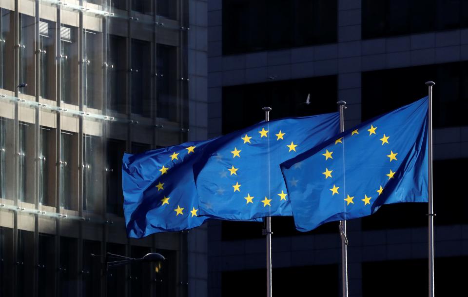 FILE PHOTO: European Union flags fly outside the European Commission headquarters in Brussels, Belgium, December 12, 2019. REUTERS/Yves Herman