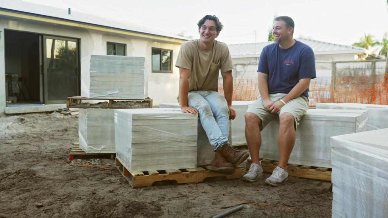 Tyler Cameron talks with house-flipping expert, Robb Ritch, while filming Amazon Prime's "Going Home with Tyler Cameron."