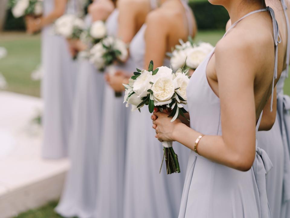 bridesmaid standing in a line at a wedding ceremony