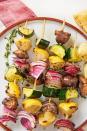 <p>These kabobs have the *perfect* combination of flavors and textures. Serve them up with our ultimate <a href="https://www.delish.com/cooking/recipe-ideas/a27394588/quinoa-burger/" rel="nofollow noopener" target="_blank" data-ylk="slk:meat-lovers veggie burger;elm:context_link;itc:0" class="link ">meat-lovers veggie burger</a> for a backyard vegetarian feast that even a carnivore couldn't turn down.</p><p>Get the <strong><a href="https://www.delish.com/cooking/recipe-ideas/a32675717/veggie-kabobs/" rel="nofollow noopener" target="_blank" data-ylk="slk:Veggie Kabobs recipe;elm:context_link;itc:0" class="link ">Veggie Kabobs recipe</a></strong>.</p>