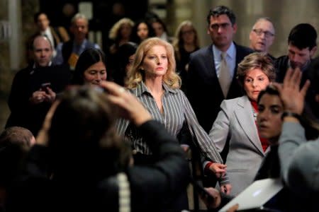 FILE PHOTO: Summer Zervos, a former contestant on The Apprentice, leaves New York State Supreme Court with attorney Gloria Allred, after a hearing on the defamation case against U.S. President Donald Trump in Manhattan, New York City, U.S., December 5, 2017.  REUTERS/Andrew Kelly/File Photo