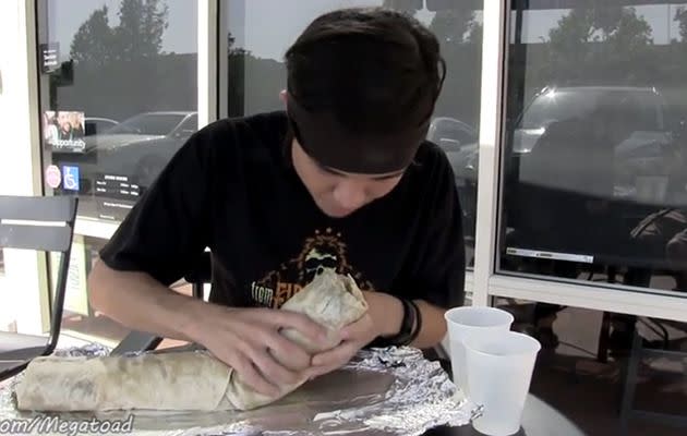 Matt Stonie tackles the giant burrito. Photo: YouTube.