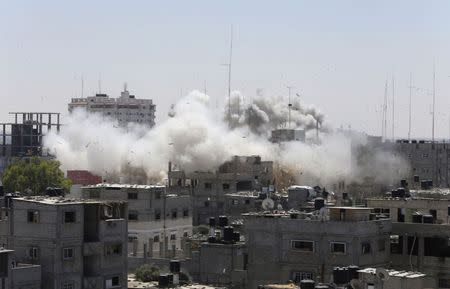 Smoke rises following what witnesses said were Israeli air strikes in Rafah in southern Gaza in this August 1, 2014 file photo. REUTERS/Ibraheem Abu Mustafa/Files