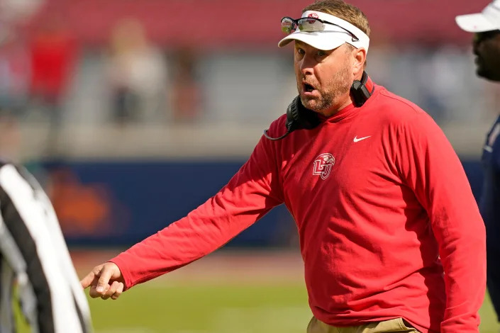 Liberty head coach Hugh Freeze has some words over a call with an official during the first half of an NCAA college football game against Mississippi in Oxford, Miss., Saturday, Nov. 6, 2021. Mississippi won 27-14. (AP Photo/Rogelio V. Solis)