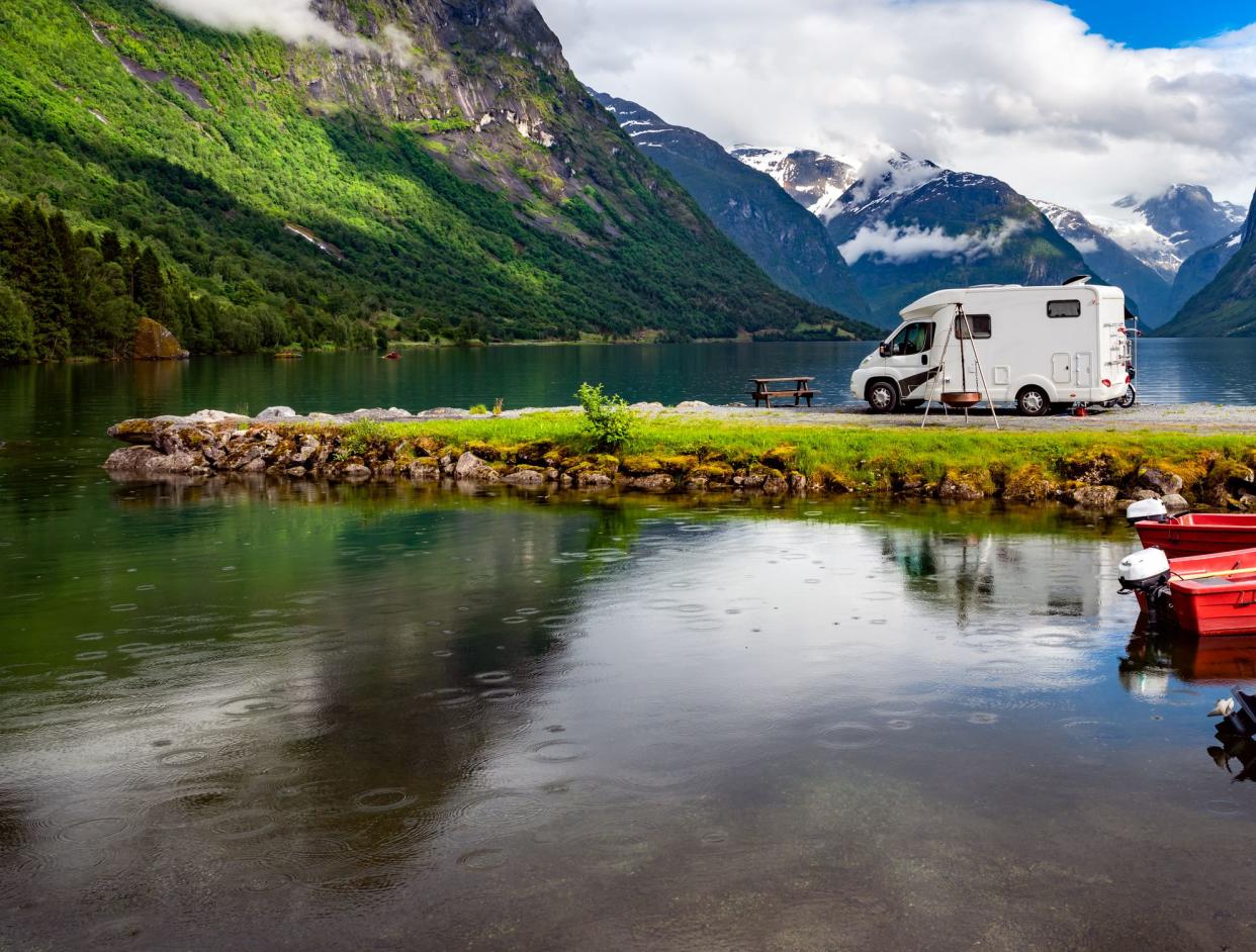 Family vacation travel RV, holiday trip in motorhome, Caravan car Vacation. Beautiful Nature Norway natural landscape.