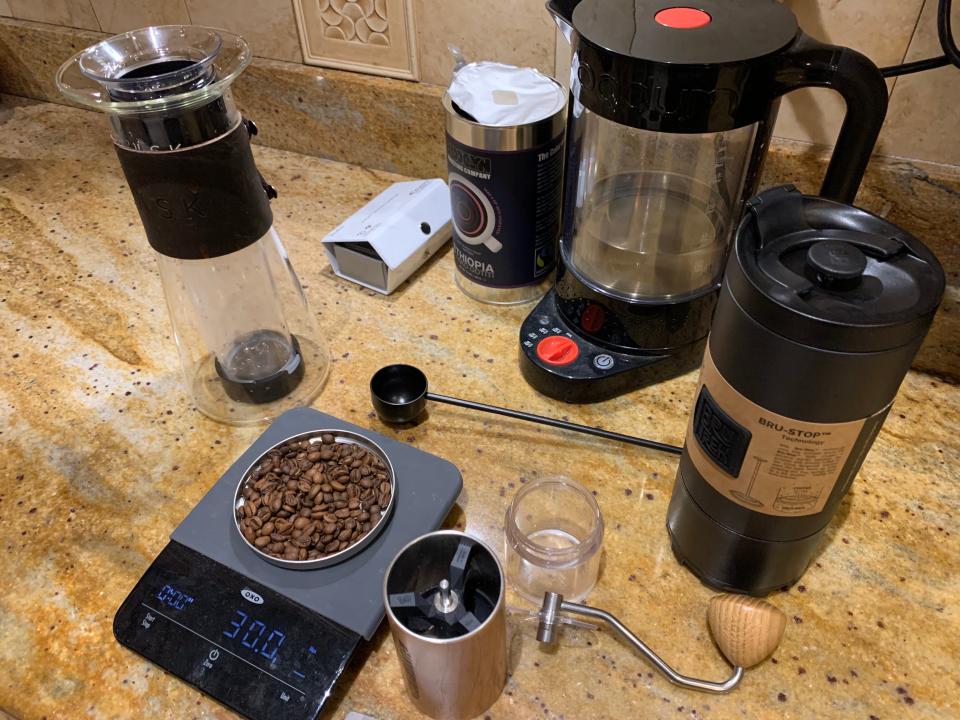 Two French presses, a coffee grinder, scale, and beans, testing for the best French press 2022