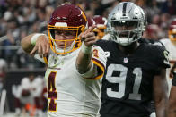 Washington Football Team quarterback Taylor Heinicke (4) celebrates after running for a gain against the Las Vegas Raiders during the second half of an NFL football game, Sunday, Dec. 5, 2021, in Las Vegas. (AP Photo/Rick Scuteri)