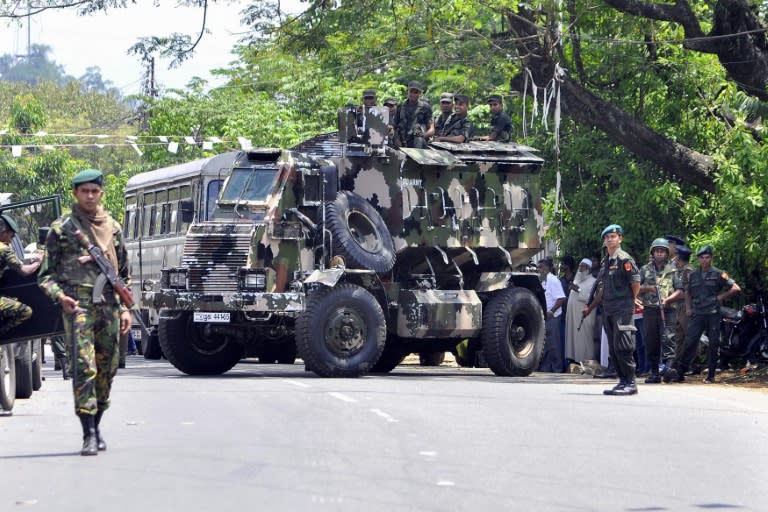 Police commandos patrol Pallekele, a suburb of Kandy, following anti-Muslim riots