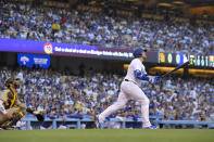 Los Angeles Dodgers' Max Muncy, right, heads to first hits a solo home run as San Diego Padres catcher Austin Nola watches during the second inning of a baseball game Friday, July 1, 2022, in Los Angeles. (AP Photo/Mark J. Terrill)