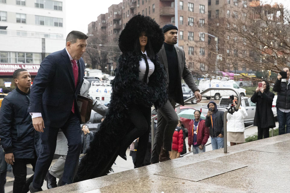 Rapper Cardi B arrives at Queens Criminal Court on charges stemming from an 2018 fight at a Queens strip club, Tuesday, Dec. 10, 2019 in New York. Prosecutors obtained a felony indictment in June. (AP Photo/Mark Lennihan)