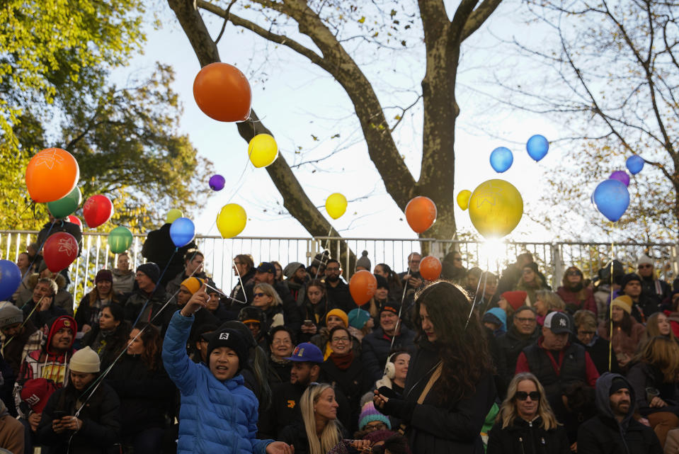 Spectators watch from the start point of the Macy's Thanksgiving Day Parade, Thursday, Nov. 24, 2022, in New York. (AP Photo/Julia Nikhinson)