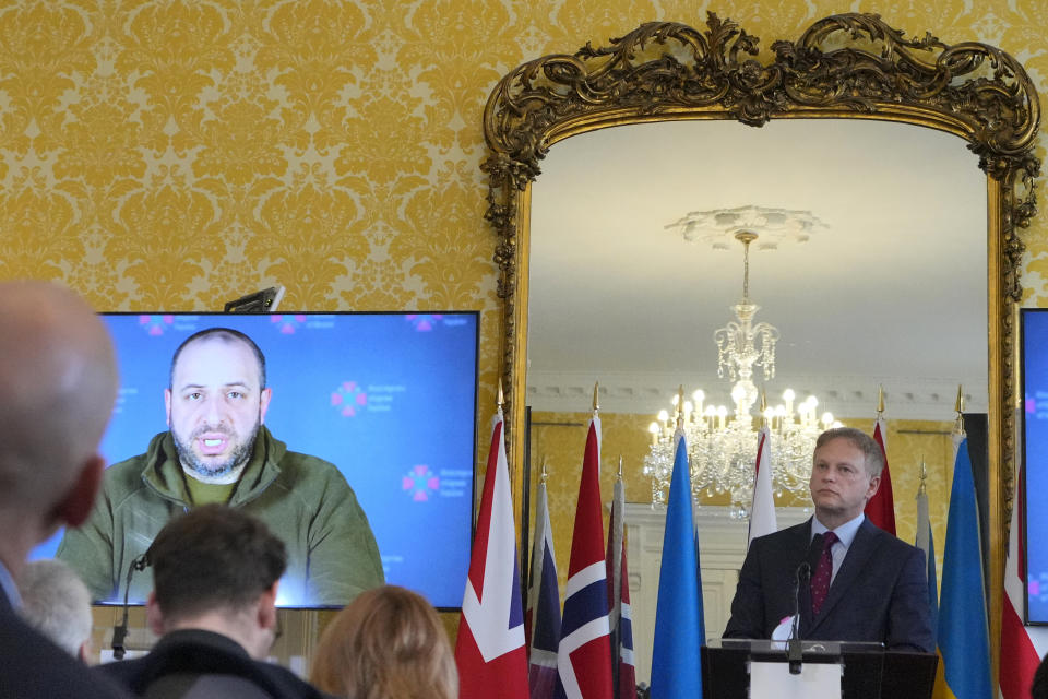 Britain's Defence Secretary Grant Shapps listens as Ukraine's Minister of Defence Rustem Umerov speaks via video link, during a press conference with Norway's Minister of Defence Bjorn Arild Gram and Vice Admiral Oleksii Neizhpapa of Ukraine, in London, Monday, Dec. 11, 2023. Britain's Ministry of Defense is transferring two minehunting ships to Ukraine as part of a package of long-term support to bolster security in the Black Sea. The transfer comes as Britain and Norway announce plans for a new maritime coalition to increase support for Ukraine in the war with Russia. (AP Photo/Kirsty Wigglesworth)