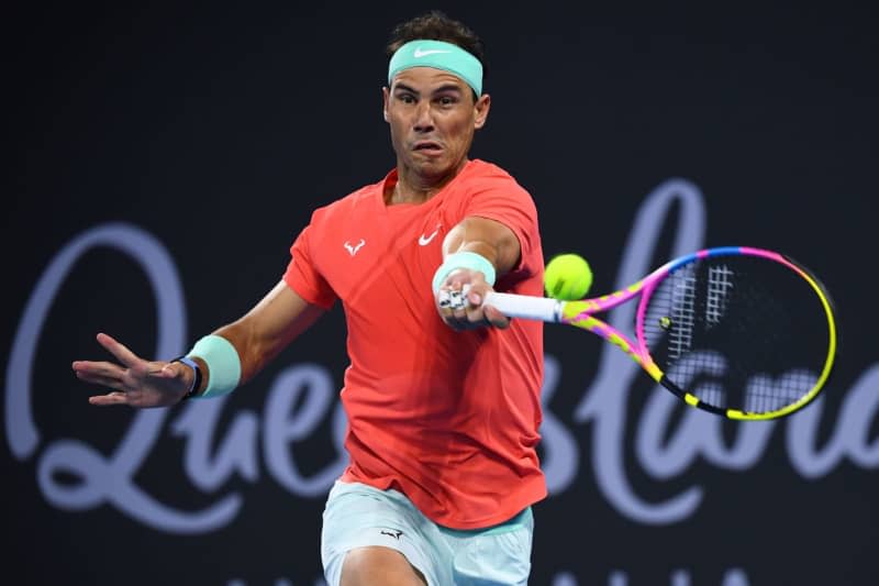 Spanish tennis player Rafael Nadal in action against Austria's Dominic Thiem during their men's singles round of 32 tennis match on Day 3 of the 2024 Brisbane International at the Queensland Tennis Centre. Jono Searle/AAP/dpa