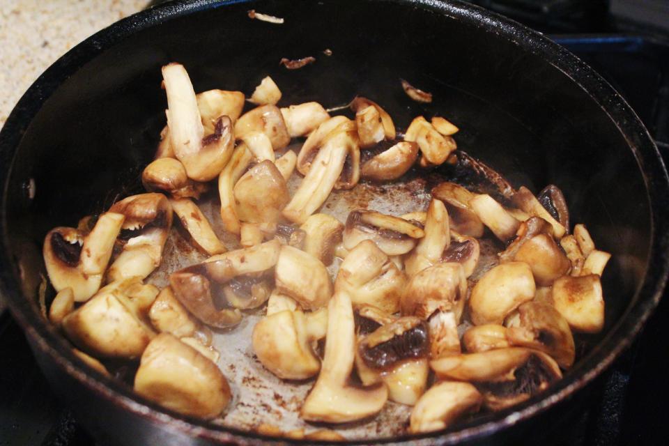 mushrooms sautéing in a pan