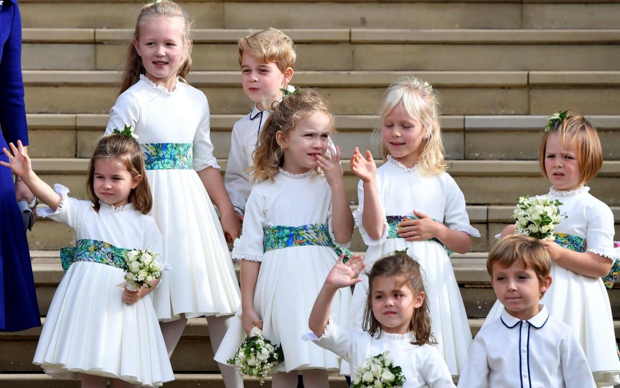 The bridesmaids and page boys wave as they leave the chapel after the wedding of Princess Eugenie to Jack Brooksbank  - REUTERS