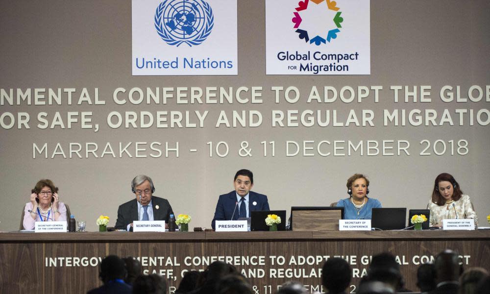 Moroccan foreign affairs minister, Nasser Bourita (C) speaks at the UN Migration Conference in Marrakesh where the first global pact on migration was formally adopted