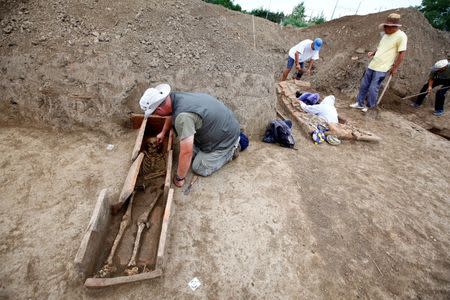 Archaeologists work at the Viminacium site, around 100km east from Belgrade, Serbia August 8, 2016. Picture taken August 8, 2016. REUTERS/Djordje Kojadinovic