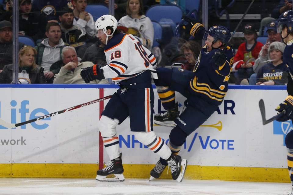 Buffalo Sabres defenseman Rasmus Ristolainen (55) and Edmonton Oilers forward James Neal (18) collide during the second period of an NHL hockey game Thursday, Jan. 2, 2020, in Buffalo, N.Y. (AP Photo/Jeffrey T. Barnes)