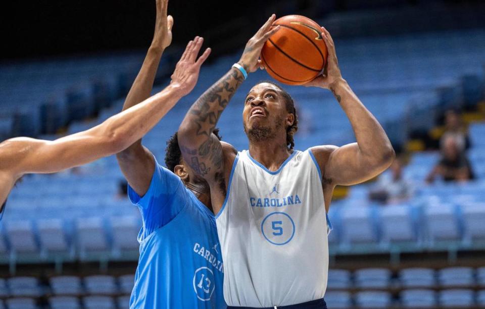 North Carolina’s Armando Bacot (5) muscles his way to the basket against Jalen Washington (13) during the Tar Heels’ open practice on Friday, October 6, 2023 at the Dean Smith Center in Chapel Hill, N.C.