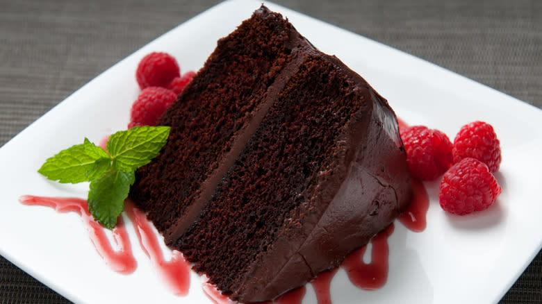 slice of chocolate cake with raspberries