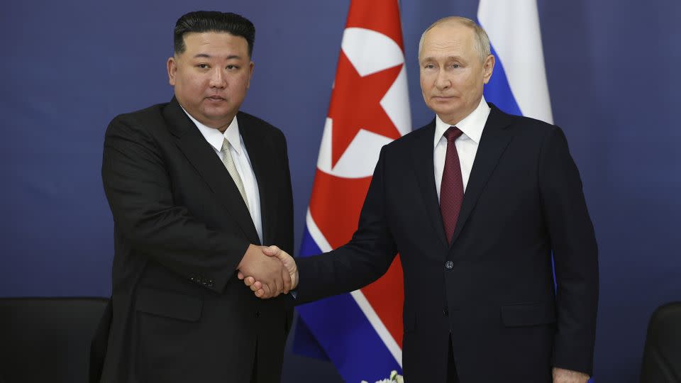 Kim Jong Un and Vladimir Putin shake hands as they begin their talks at the Vostochny Cosmodrome, Amur region, Russia, on September 13. - Vladimir Smirnov/Sputnik/AP