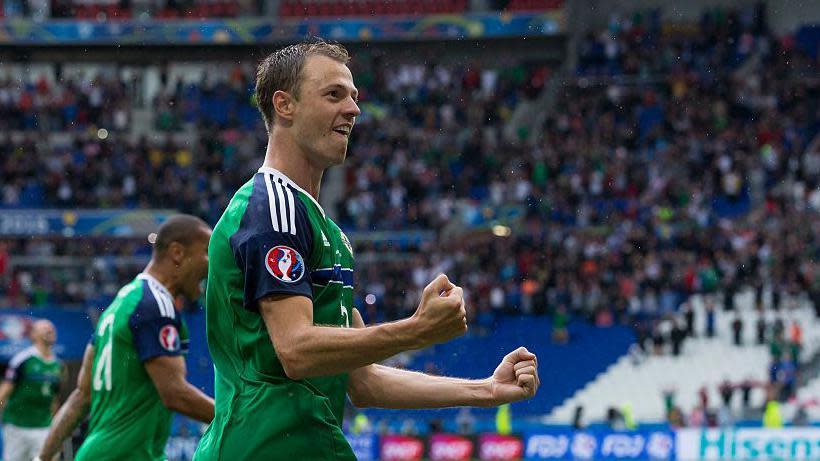 Jonny Evans celebrates Northern Ireland's win over Ukraine at Euro 2016 