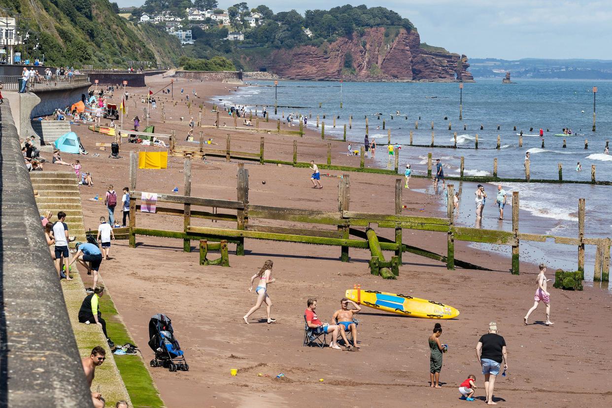 Tourists on Monday at Teignmouth, Devon, UK. (Alamy)