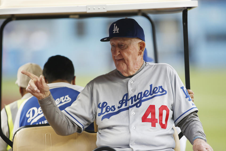 FILE - Former Los Angeles Dodgers' Roger Craig, on hand for the Dodgers' Old Timers Game festivities, points as he rides in a cart before the baseball game between the Dodgers and Colorado Rockies, Saturday, May 16, 2015, in Los Angeles. Craig, who pitched for three championship teams during his major league career and then managed the San Francisco Giants to the 1989 World Series that was interrupted by a massive earthquake, died Sunday, June 4, 2023. He was 93. (AP Photo/Danny Moloshok, File)