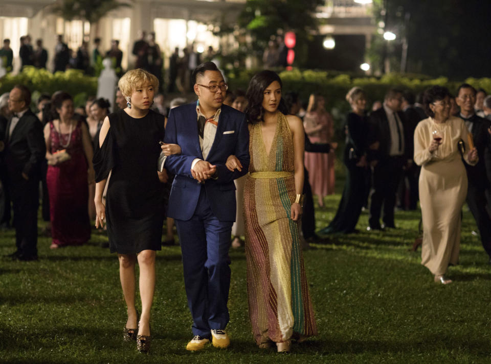 This image released by Warner Bros. Entertainment shows, from left, Awkwafina, Nico Santos, and Constance Wu in a scene from the film “Crazy Rich Asians.” (Sanja Bucko/Warner Bros. Entertainment via AP)