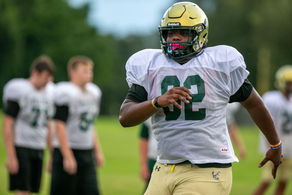 Trinity Catholic offensive lineman Tommy Kinsler works during practice in Ocala. Kinsler flipped from Florida to Miami late last month.