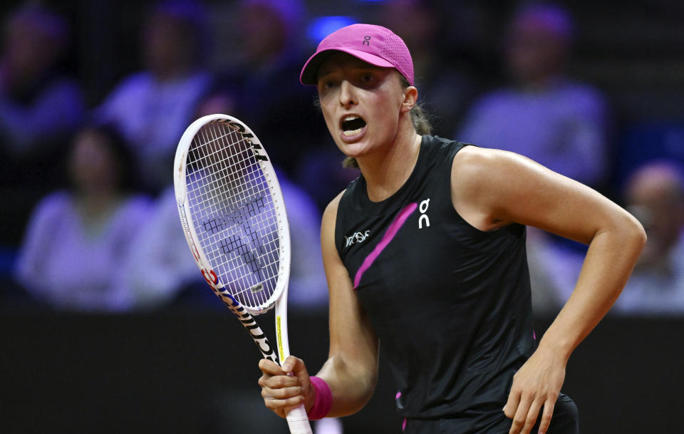 Poland's Iga Swiatek celebrates defeating Belgium's Elise Mertens after the women's singles round of 16 tennis match at the WTA Tour in Stuttgart, Germany, Thursday April 18, 2024. (Marijan Murat/ after her victory. Photo: Marijan Murat/dpa via AP)