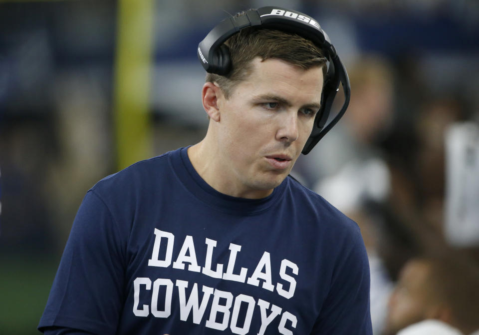 Dallas Cowboys offensive coordinator Kellen Moore talks with players on the sideline in the second half of a NFL football game against the New York Giants in Arlington, Texas, Sunday, Sept. 8, 2019. (AP Photo/Ron Jenkins)