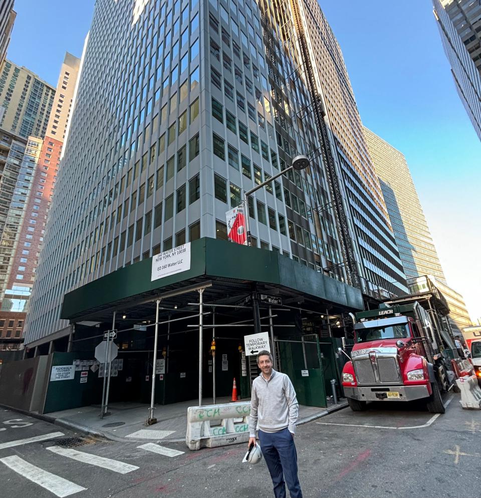 Joey Chilelli, managing director at Vanbarton Group LLC, stands outside 160 Water Street in Manhattan which is being converted from an office tower to a residential building.