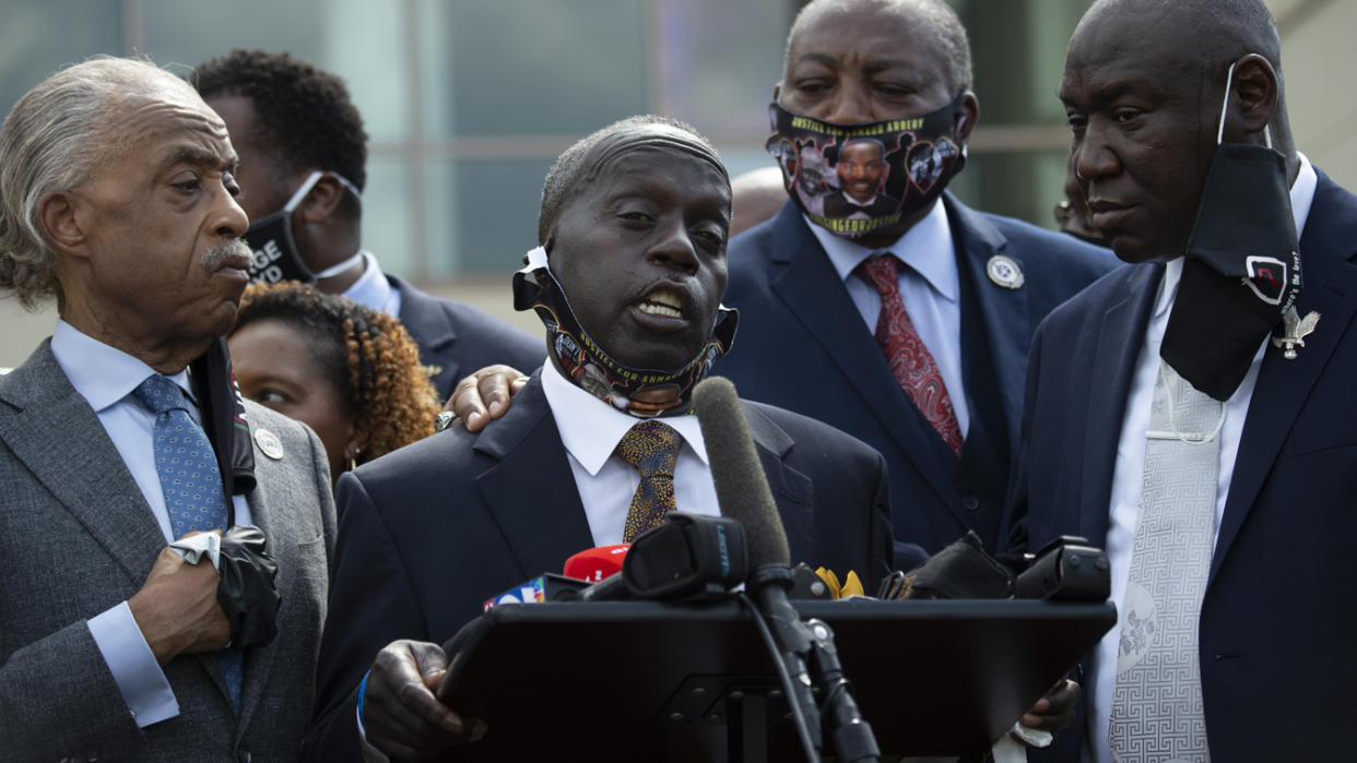 Marcus Arbery with the Rev. Al Sharpton, attorney Benjamin Crump and members of the Floyd family during a public viewing for George Floyd.