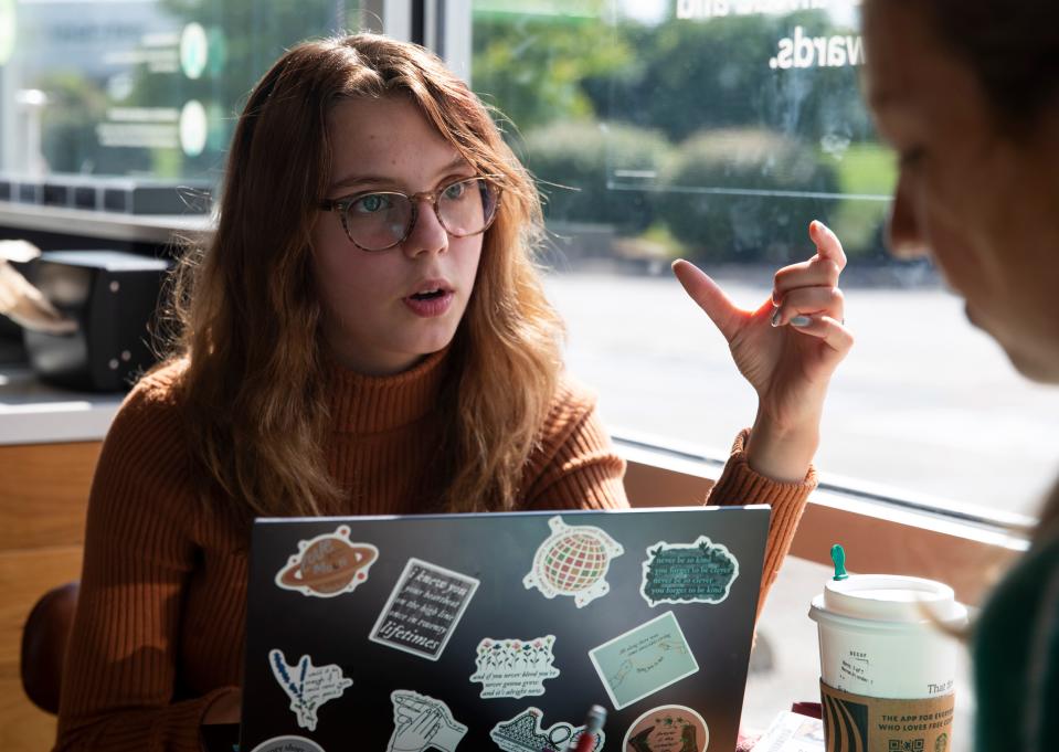 Sarah Pfleeger and Lillie Duncan work on the sequel to their book, Wednesday, Aug. 24, 2022, at Starbucks in Lebanon, Ind. 