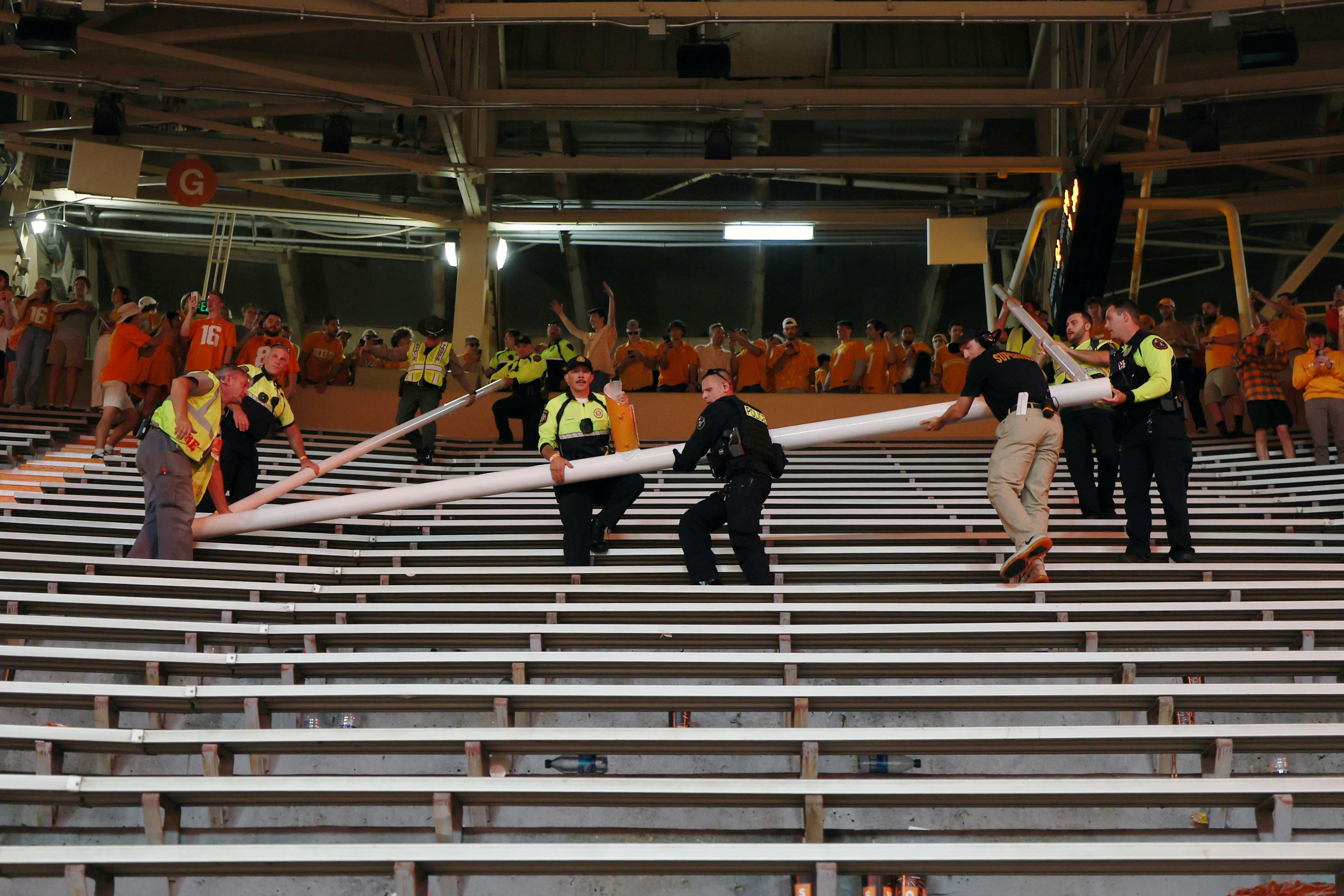 KNOXVILLE, TENNESSEE - OCTOBER 15: Police take control of a field goal post carried into the stands by fans after the Tennessee Volunteers defeat the Alabama Crimson Tide at Neyland Stadium on October 15, 2022 in Knoxville, Tennessee. Tennessee won the game 52-49. (Photo by Donald Page/Getty Images)