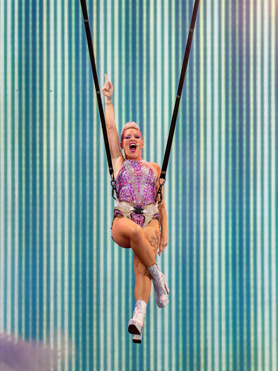 Pink singing during a mid-air plunge at PNC Park.