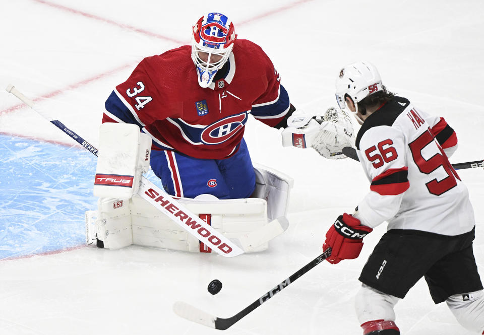 New Jersey Devils' Erik Haula (56) moves in on Montreal Canadiens goaltender Jake Allen during the second period of an NHL hockey game Saturday, March 11, 2023, in Montreal. (Graham Hughes/The Canadian Press via AP)