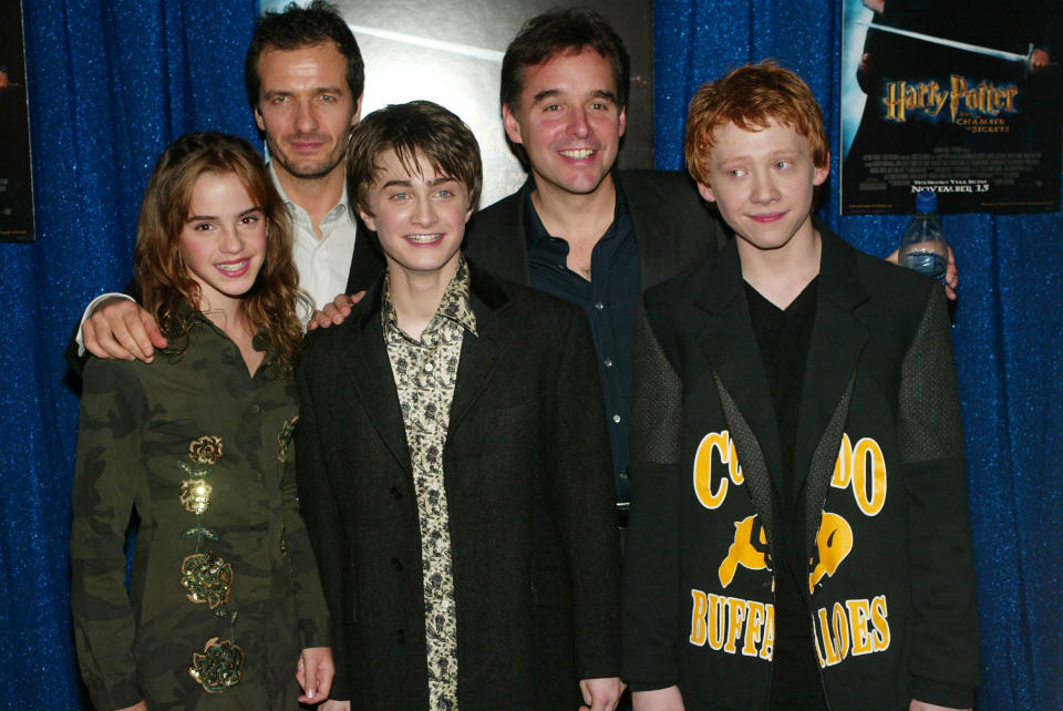 The cast poses with Chris at an event