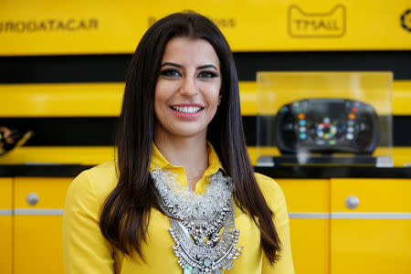 Formula One F1 - French Grand Prix - Circuit Paul Ricard, Le Castellet, France - June 24, 2018 Aseel Al-Hamad of Saudia Arabia poses for a photo before driving a Lotus Renault E20 Formula One car during a parade before the race REUTERS/Jean-Paul Pelissier