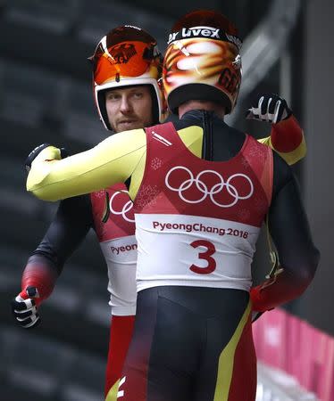 Luge - Pyeongchang 2018 Winter Olympics - Men's Doubles Competition - Olympic Sliding Centre - Pyeongchang, South Korea - February 14, 2018. Tobias Wendl and Tobias Arlt of Germany react after their run. REUTERS/Edgar Su