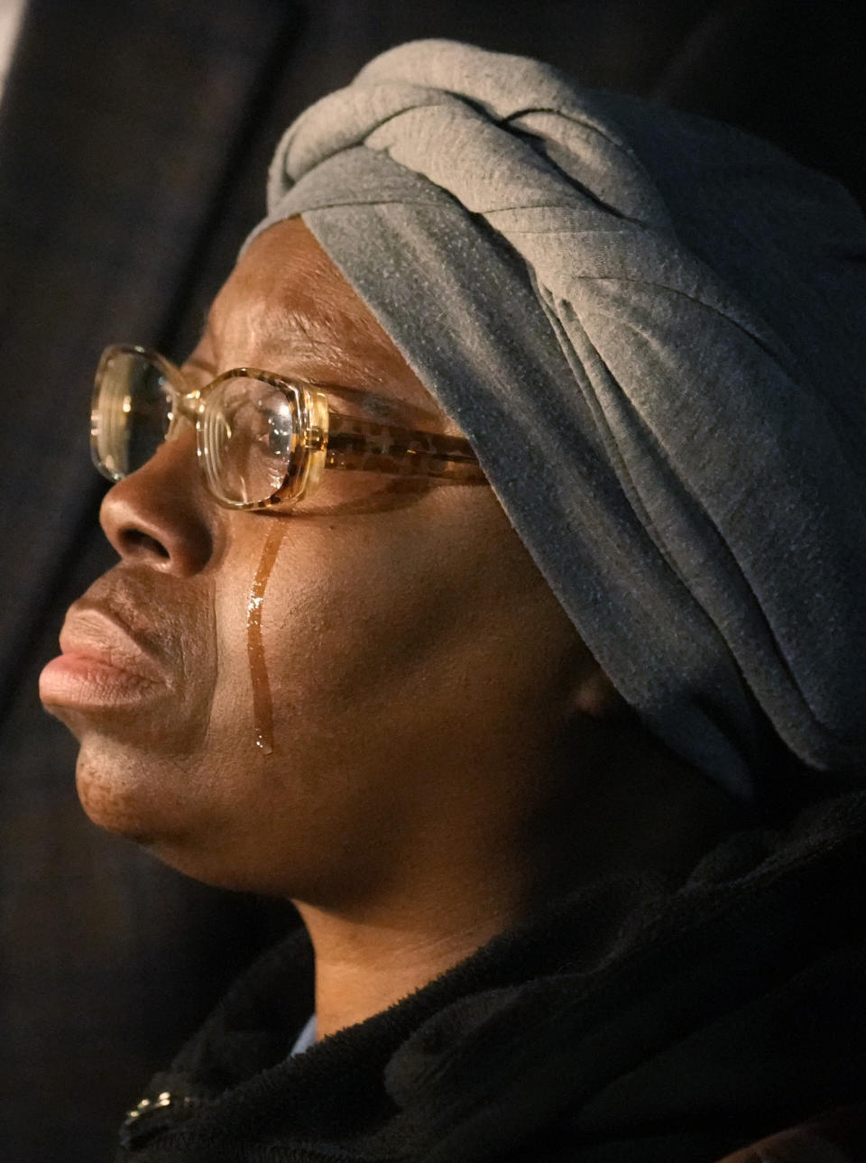 A tear runs down the cheek of Sheneen McClain outside the Adams County Colo., Justice Center, after a verdict was rendered in the killing of her son Elijah McClain, Friday, Dec. 22, 2023, in Brighton, Colo. Two paramedics were convicted in the 2019 killing of McClain, who they injected with an overdose of the sedative ketamine after police put him in a neck hold. (AP Photo/David Zalubowski)