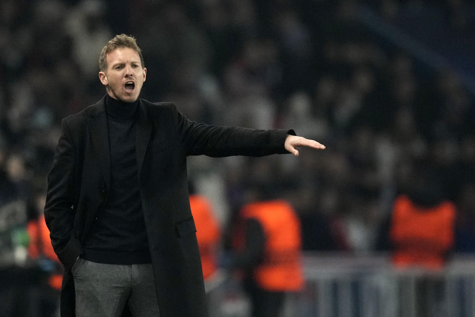 FILE - Then Bayern's head coach Julian Nagelsmann gives instructions to his players during the Champions League round of 16 first leg soccer match between Paris Saint Germain and Bayern Munich, at the Parc des Princes stadium, in Paris, France, Tuesday, Feb. 14, 2023. Germany has appointed former Bayern Munich coach Julian Nagelsmann to lead the men’s national soccer team. The German soccer federation says Nagelsmann is taking over on a short-term contract through the European Championship next summer. Germany is hosting the tournament. (AP Photo/Christophe Ena, File)