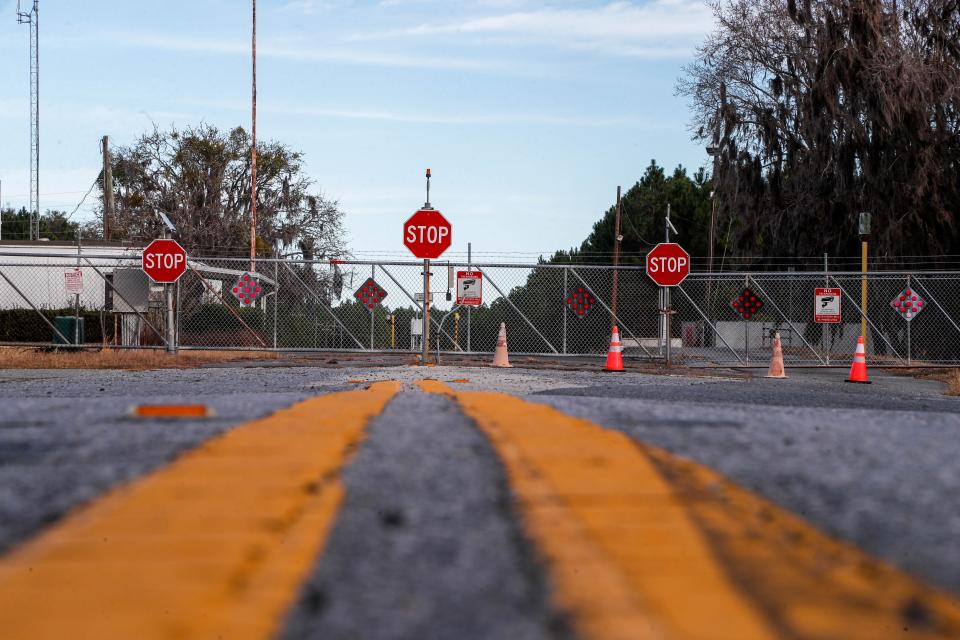 The entrance to the former Thiokol facility sits at the end of Harrietts Bluff Road, about 12 miles from I-95. Today the facility is abandoned with only a single building visible beyond the gate.