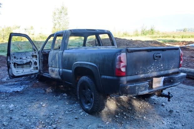 IHIT has taken over the investigation after a body was found inside a burned black pickup truck in Maple Ridge, B.C. (Ridge Meadows RCMP - image credit)