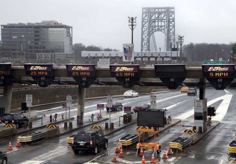 File-This Jan. 11, 2014, file photo shows traffic passing through the toll booths at the George Washington Bridge, in Fort Lee, N.J. Gov. Chris Christie made inaccurate statements during a news conference about the lane closures near the George Washington Bridge, according to a letter released Friday, Jan. 31, 2014, by a lawyer for a former Christie loyalist who ordered the closures and resigned amid the ensuing scandal that has engulfed the New Jersey governor's administration. In the letter, David Wildstein's lawyer said his client "contests the accuracy of various statements that the governor made about him and he can prove the inaccuracy of some." (AP Photo/Richard Drew, File)